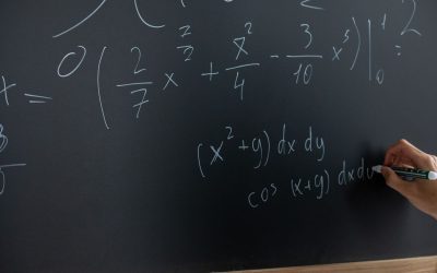 Mathematics and physics equations in a notebook for JEE Main 2027 preparation