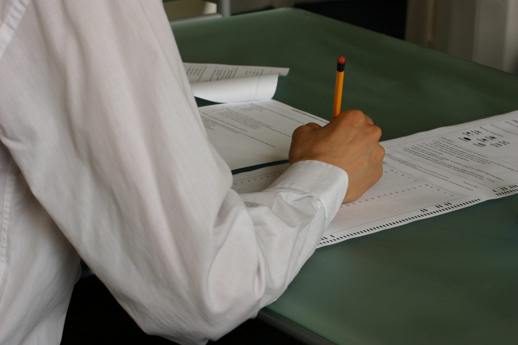 Students writing an exam in a classroom during JoSAA 2026 seat allotment season